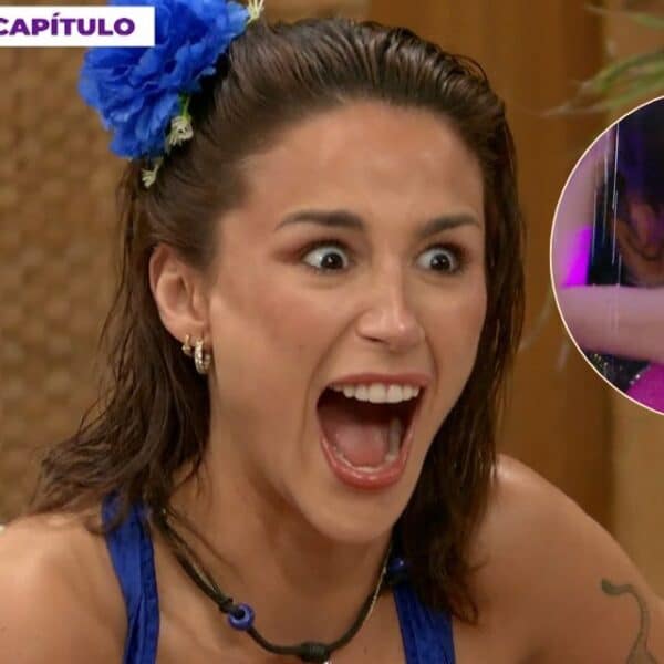 Nicolás Solabarrieta y Flavia Laos se besan durante una actividad bajo la lluvia en reality