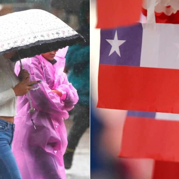 Persona arrancando de la lluvia en una calle de Chile: así se proyectan las lluvias para Fiestas Patrias 2026 en diez regiones
