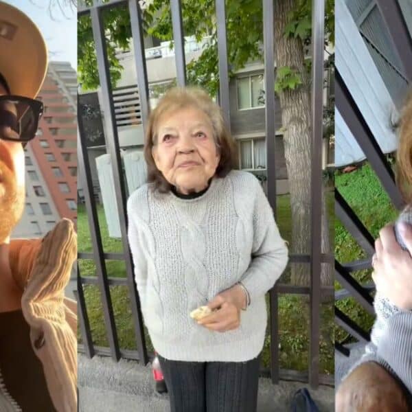 Ariel Osses durante un emotivo encuentro con una adulta mayor en la comuna de Macul, en Santiago.
